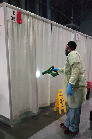 Man disinfecting a hospital room